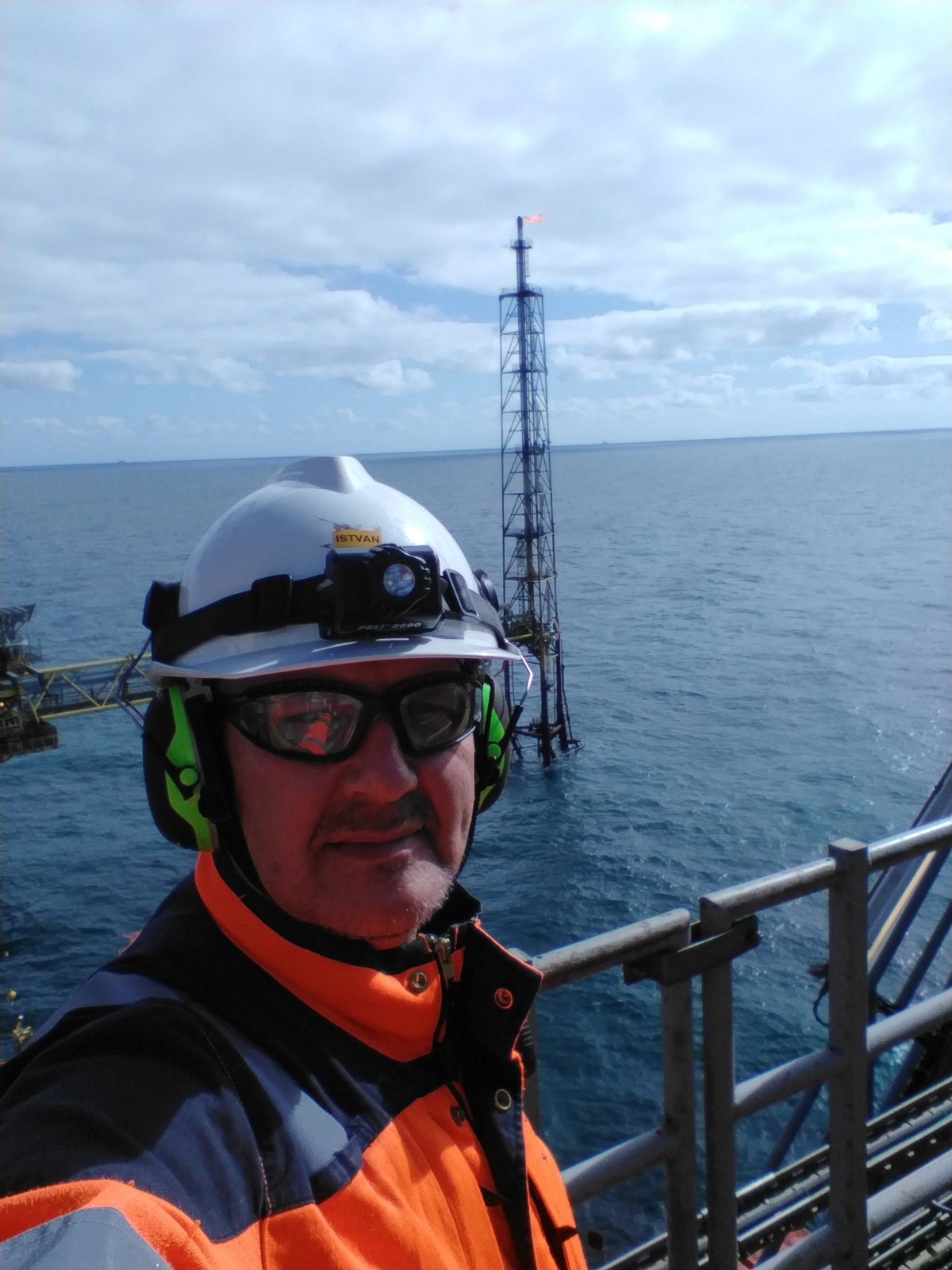 CompEx-certified Ex inspector at an offshore oil and gas platform flare tower